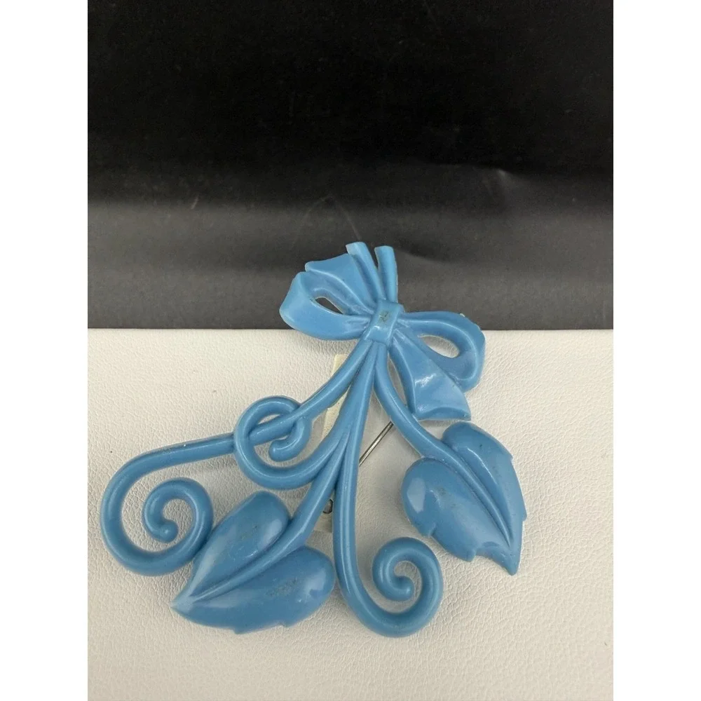 Vintage Brooch Light‎ Blue Molded Celluloid Bow